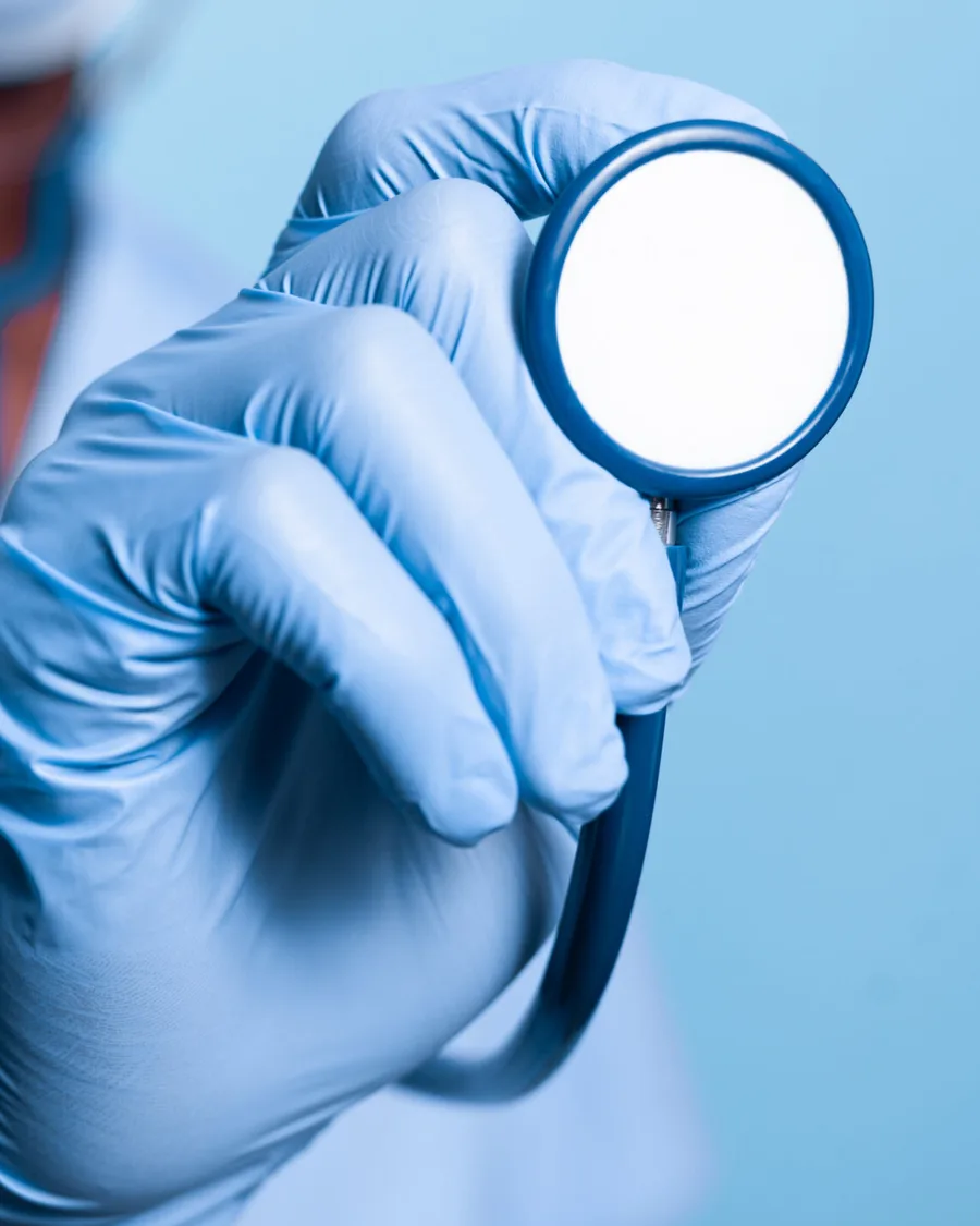 A HelloDaktari clinician holding a stethoscope, ready for a consultation